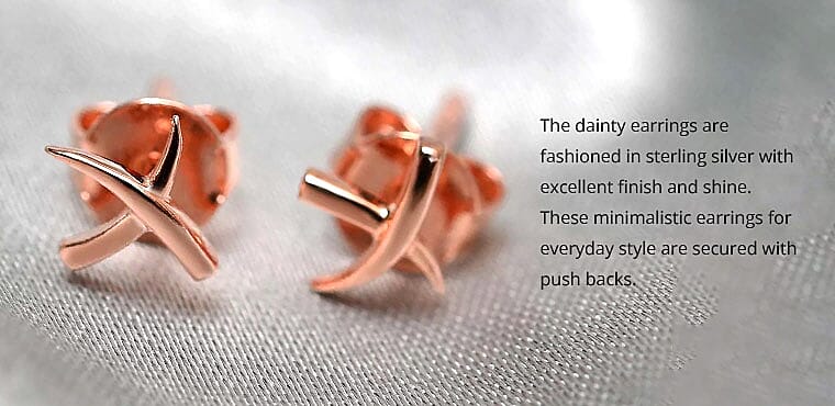 The dainty earrings are fashioned Banner