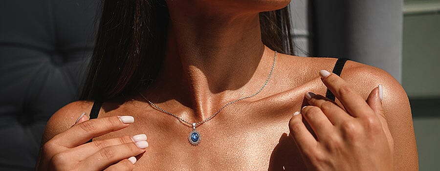Blue Star Sapphire Halo Pendant Necklace in Sterling Silver Banner