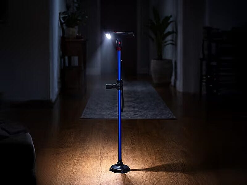 Built-in LED cane glowing in a dark hallway