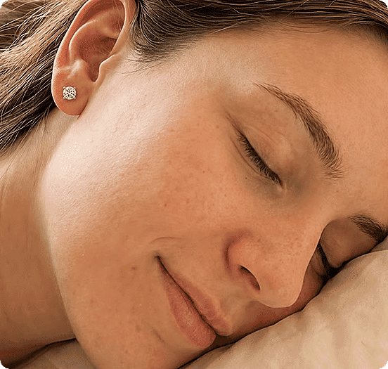 Sleeping peacefully wearing diamond studs