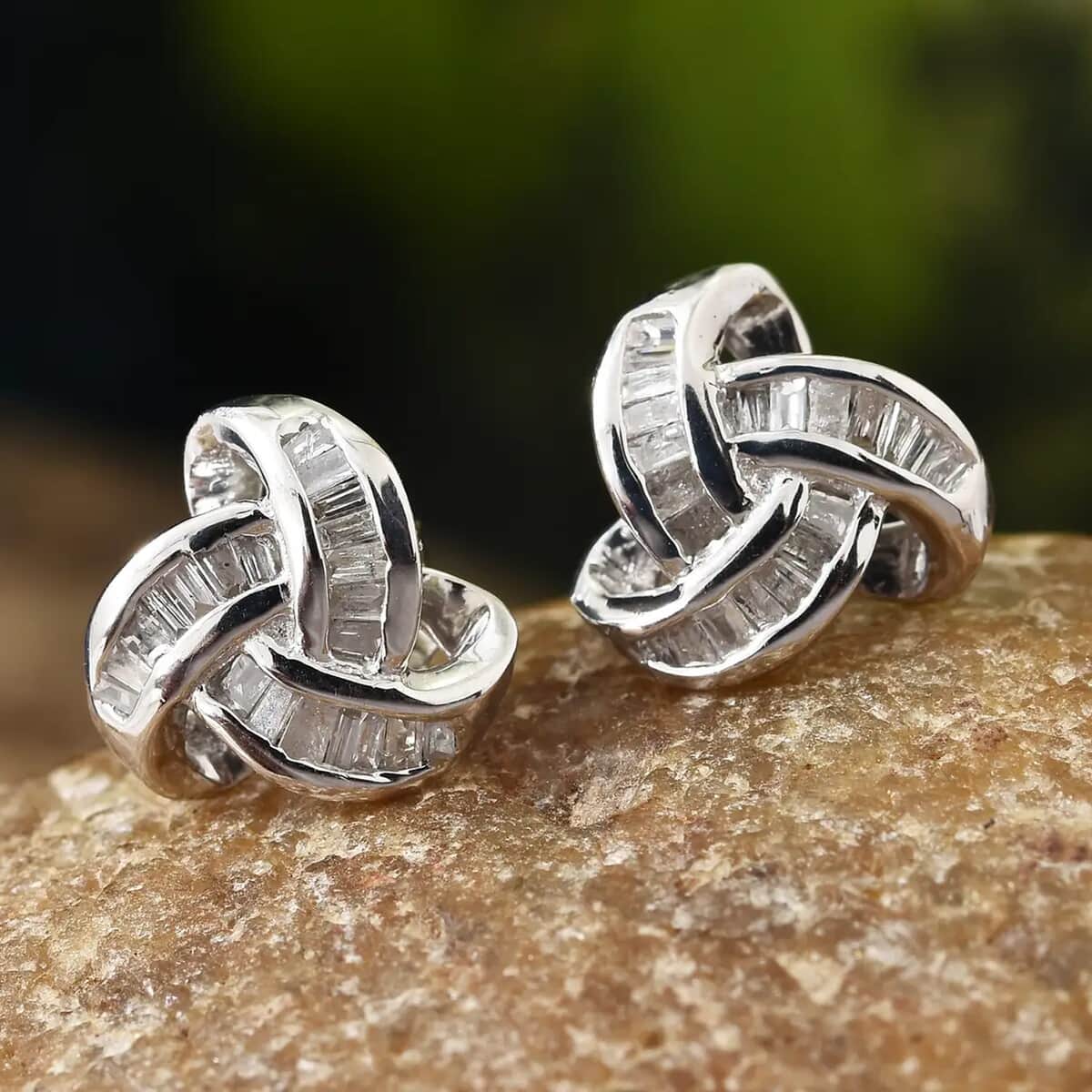 Diamond 0.25 ctw Knot Stud Earrings in Platinum Over Sterling Silver image number 1