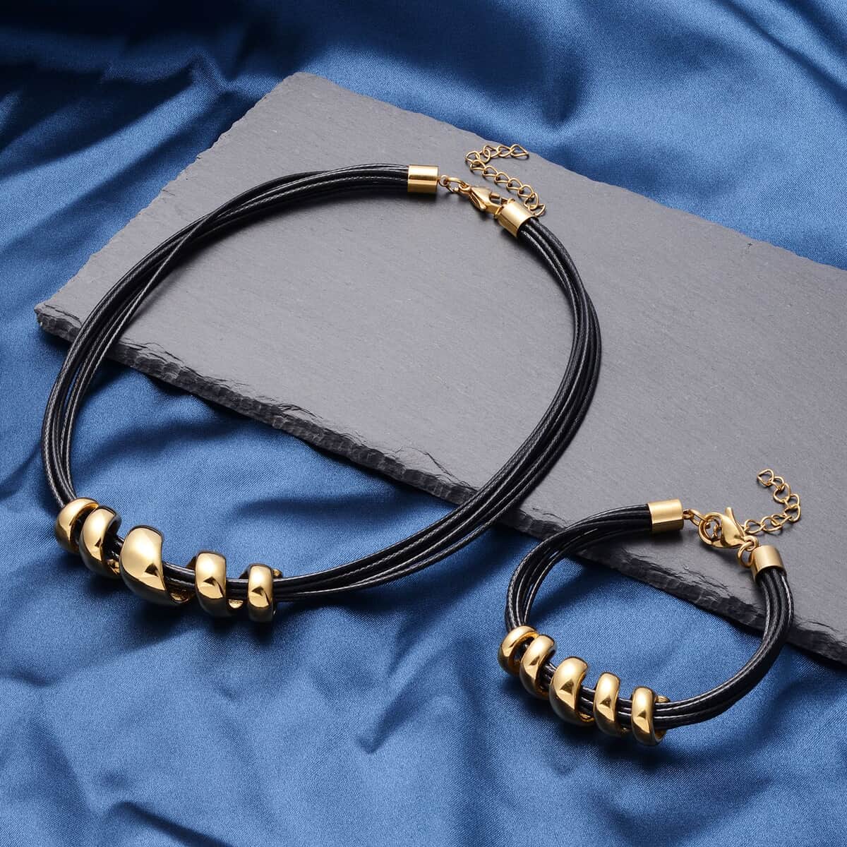 Black Faux Leather Cord Twist Bracelet (7-8.50In) and Necklace (16-18In) in ION Plated YG Stainless Steel image number 1