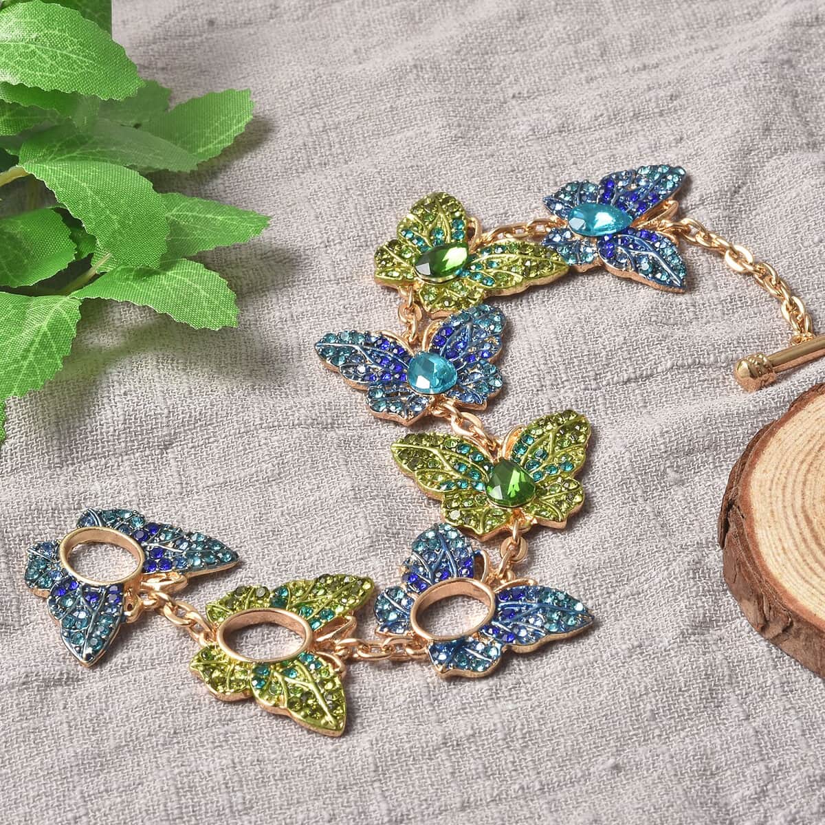 Simulated Blue and Green Diamond, Multi Color Austrian Crystal Butterfly Bracelet in Goldtone (6.50-9In) image number 1