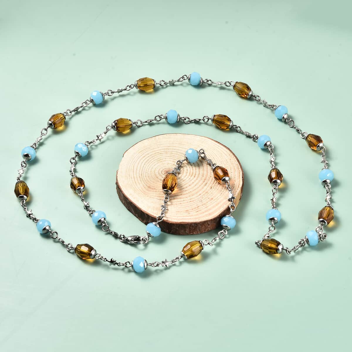 Simulated Blue and Brown Sapphire Station Necklace 36 Inches in Stainless Steel  image number 1