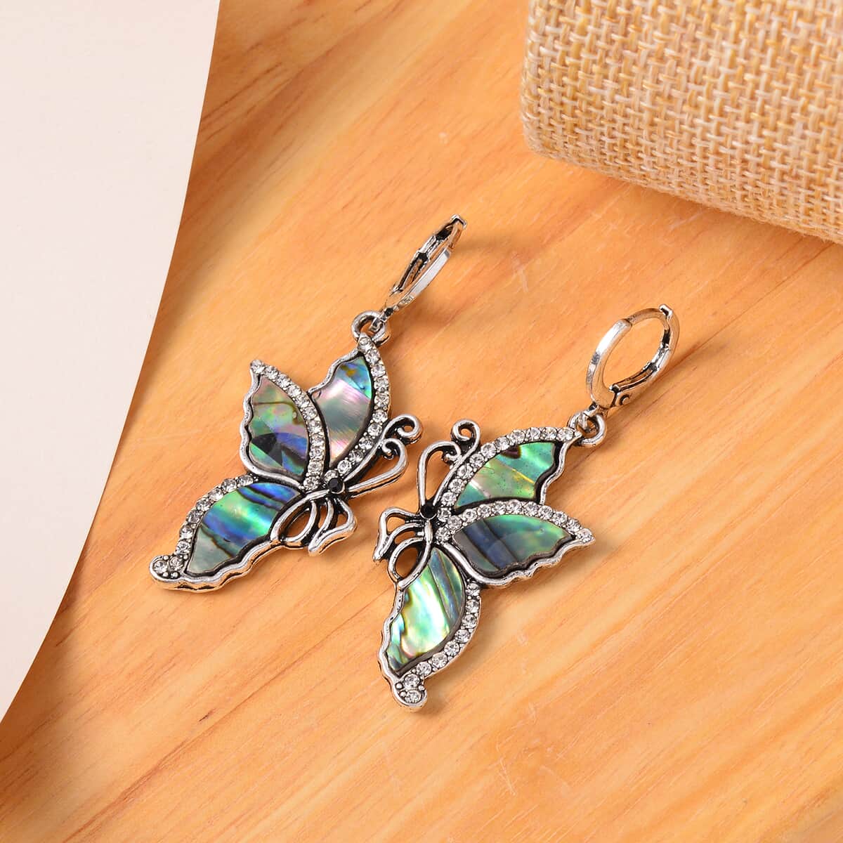 Abalone Shell and Hematite and Black Color Austrian Crystal Lever Back Butterfly Earrings in Silvertone and Stainless Steel image number 1