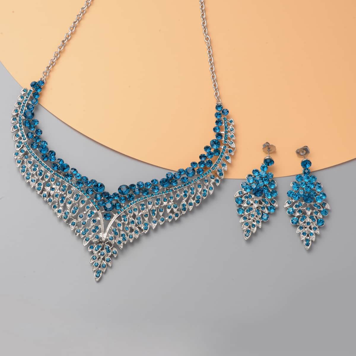 Peacock Blue Color Austrian Crystal Earrings and Bib Necklace 20-23 Inches in Silvertone image number 1