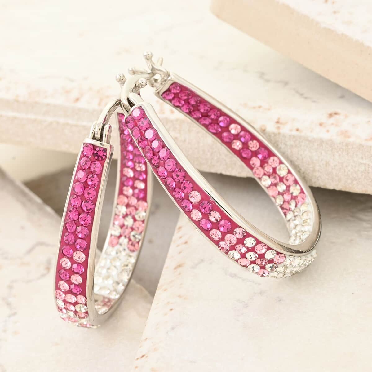 Austrian White Crystal Pink Crystal Earrings in Silvertone, Inside Out Hoops For Women image number 1