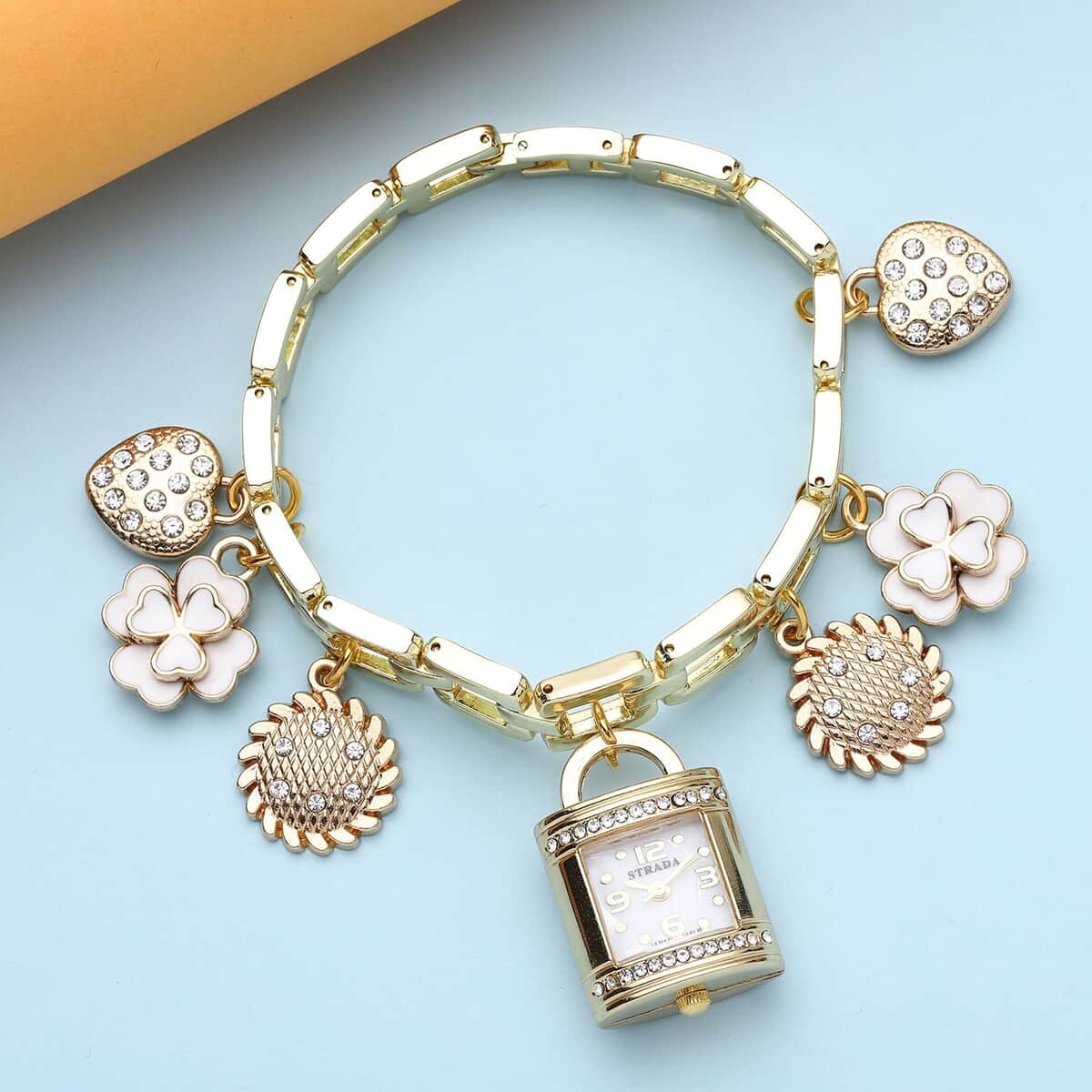 Strada Japanese Movement White Austrian Crystal Multi-Charm Bracelet Watch in Goldtone (up to 8 Inches) image number 1