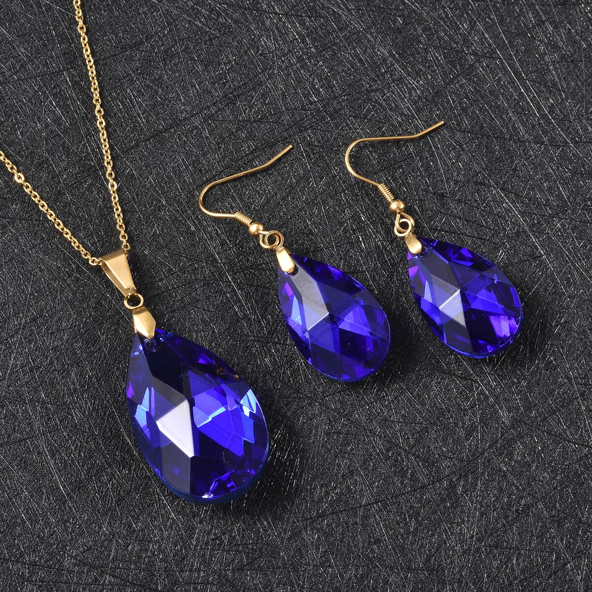 Simulated Blue Sapphire Earrings and Pendant Necklace 20 Inches in ION Plated Yellow Gold Stainless Steel image number 1