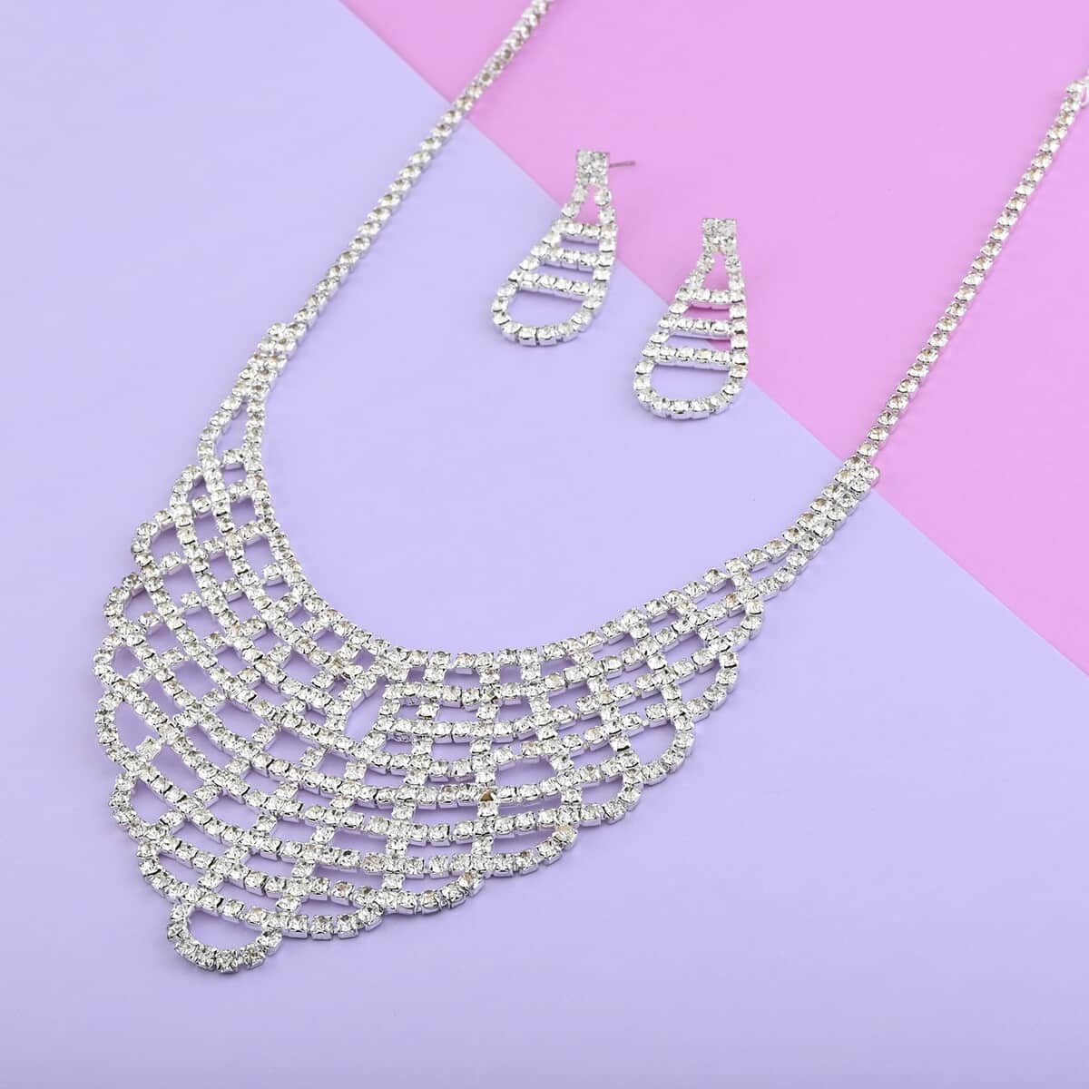 White Austrian Crystal Earrings and V Shape Necklace 22 Inches in Silvertone image number 1