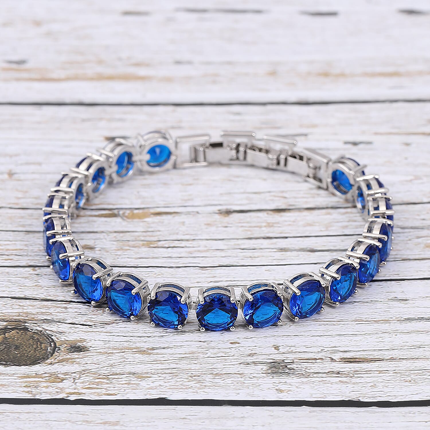Simulated Blue Diamond Tennis Bracelet in Silvertone (Adjustable Fit) 