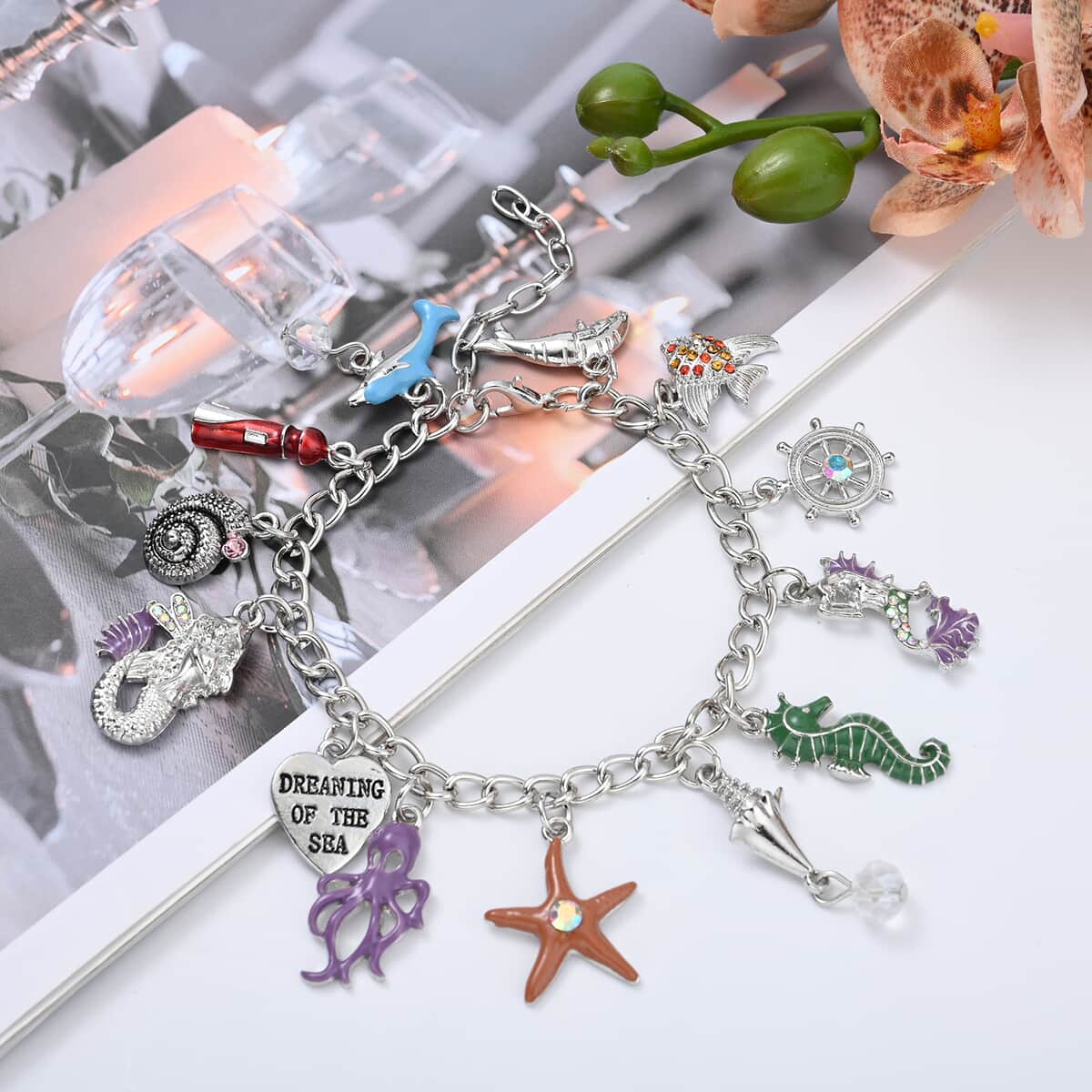 White Glass and Multi Color Austrian Crystal Bracelet with Dangling Charms in Silvertone (7.50 In) image number 1