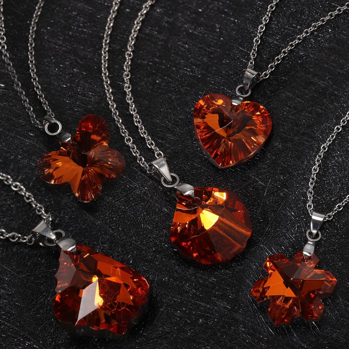 Set of 5 Orange Austrian Crystal Heart, Butterfly, Shell, Star, Heart and Fancy Shape Pendants Necklace 20-22 Inches in Silvertone image number 1