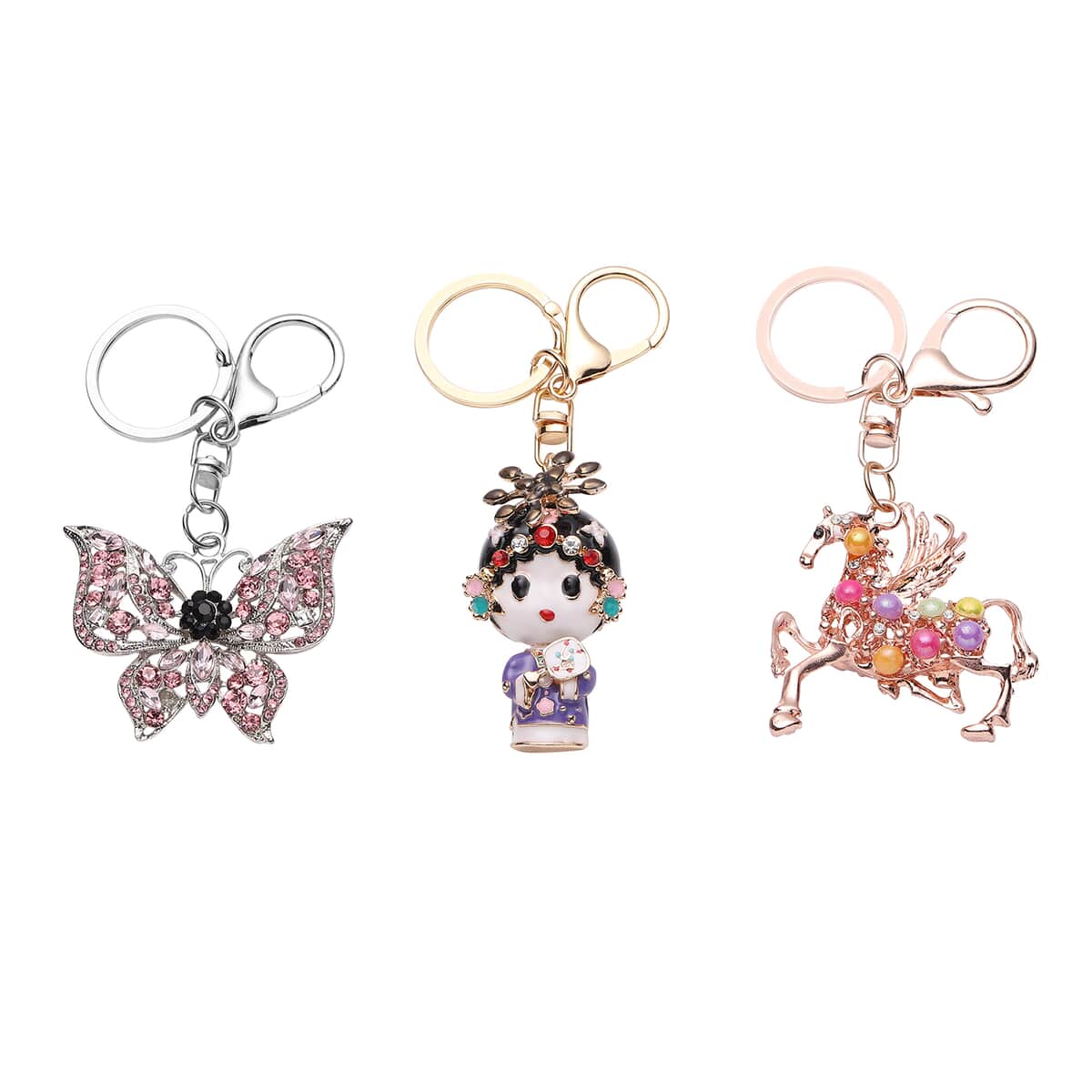 Set of 3 Multi Color Austrian Crystal, Enameled Butterfly, Unicorn and Baby Doll Keychain in Rosetone image number 0