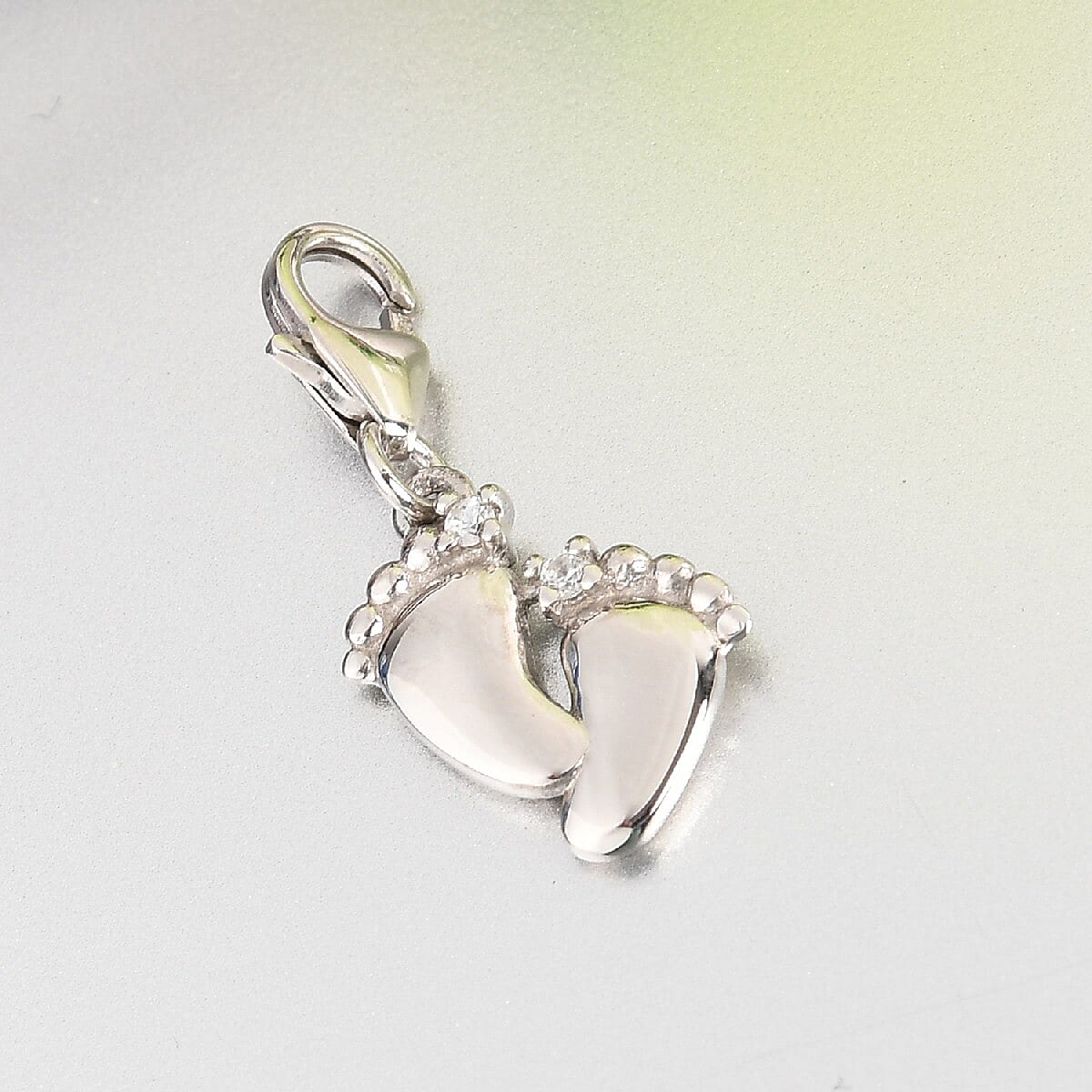 SUMMER DEALS Zircon New Born Baby Feet Sentimental Charm in Platinum Over Sterling Silver image number 1