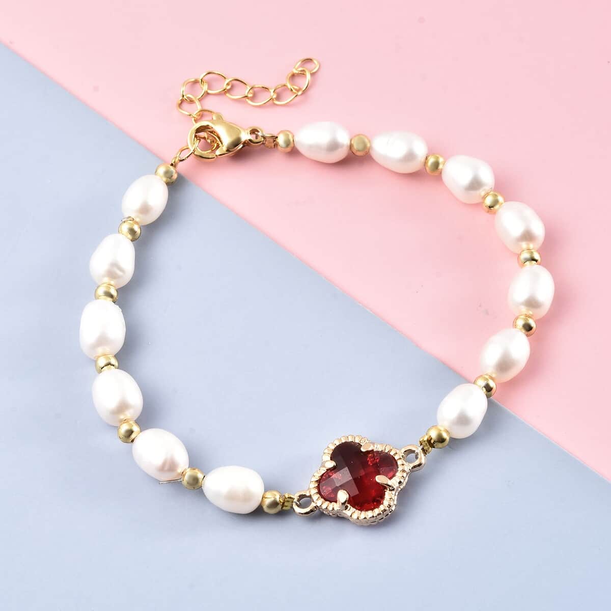 Simulated Ruby and White Freshwater Pearl Bracelet With Four Clover Leaf Charm in Goldtone Lobster Clasp (7.5-9.5-In) image number 1