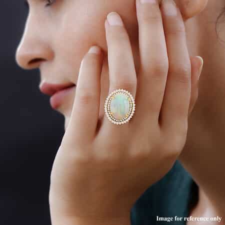 Iliana 18K Yellow Gold AAA Ethiopian Welo Opal and G-H SI Diamond Double Halo Ring (Size 7.0) 7.80 Grams 7.25 ctw image number 1