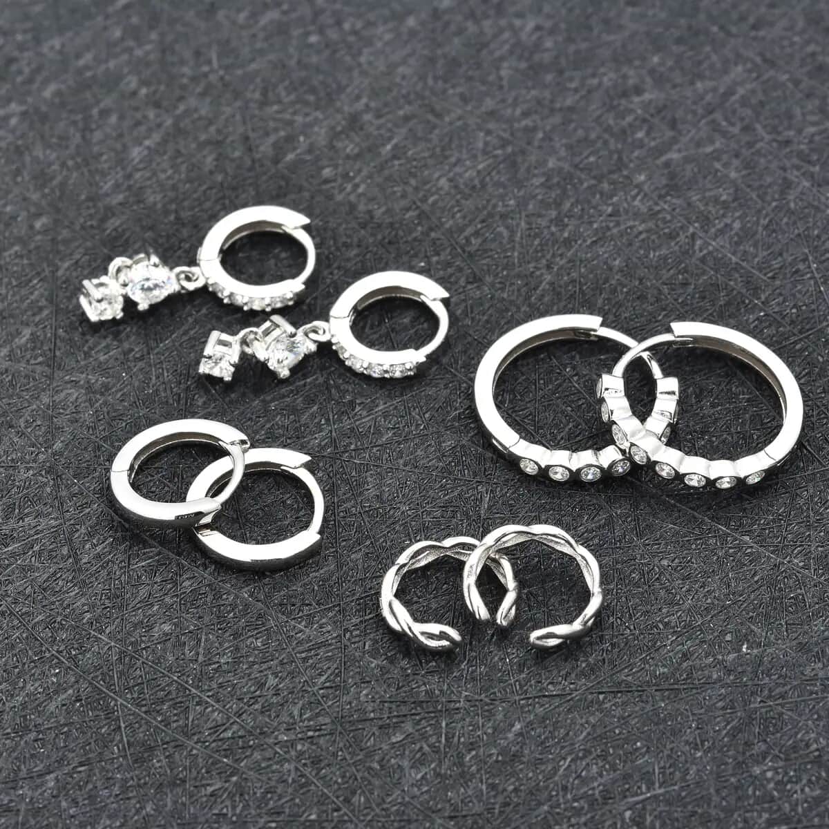 Ear Party, Set of 4 Simulated Diamond 1.30 ctw Earrings, 1 Hoops, 1 Studded & 1 Plain Huggies, 1 Criss-cross Ear Cuffs in Rhodium Over Sterling Silver image number 6