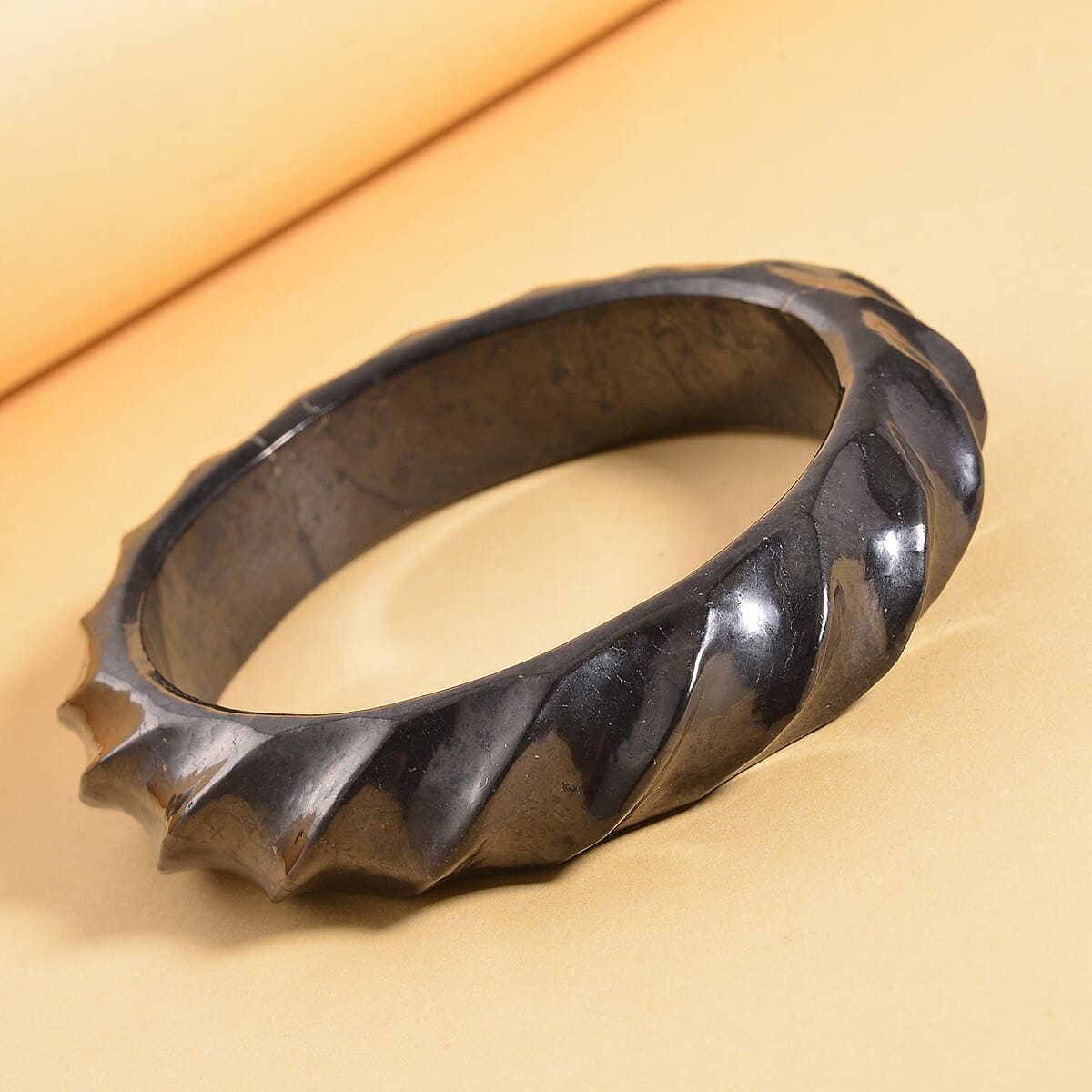 Shungite Carved Bold Twisted Bangle Bracelet (7.25 In) 250.00 ctw image number 1