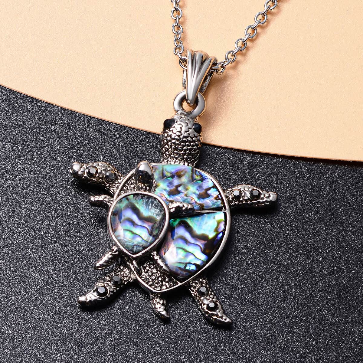 Abalone Shell, Black and Grey Austrian Crystal Turtle Pendant Necklace 20-22 Inches in Silvertone & Stainless Steel image number 1