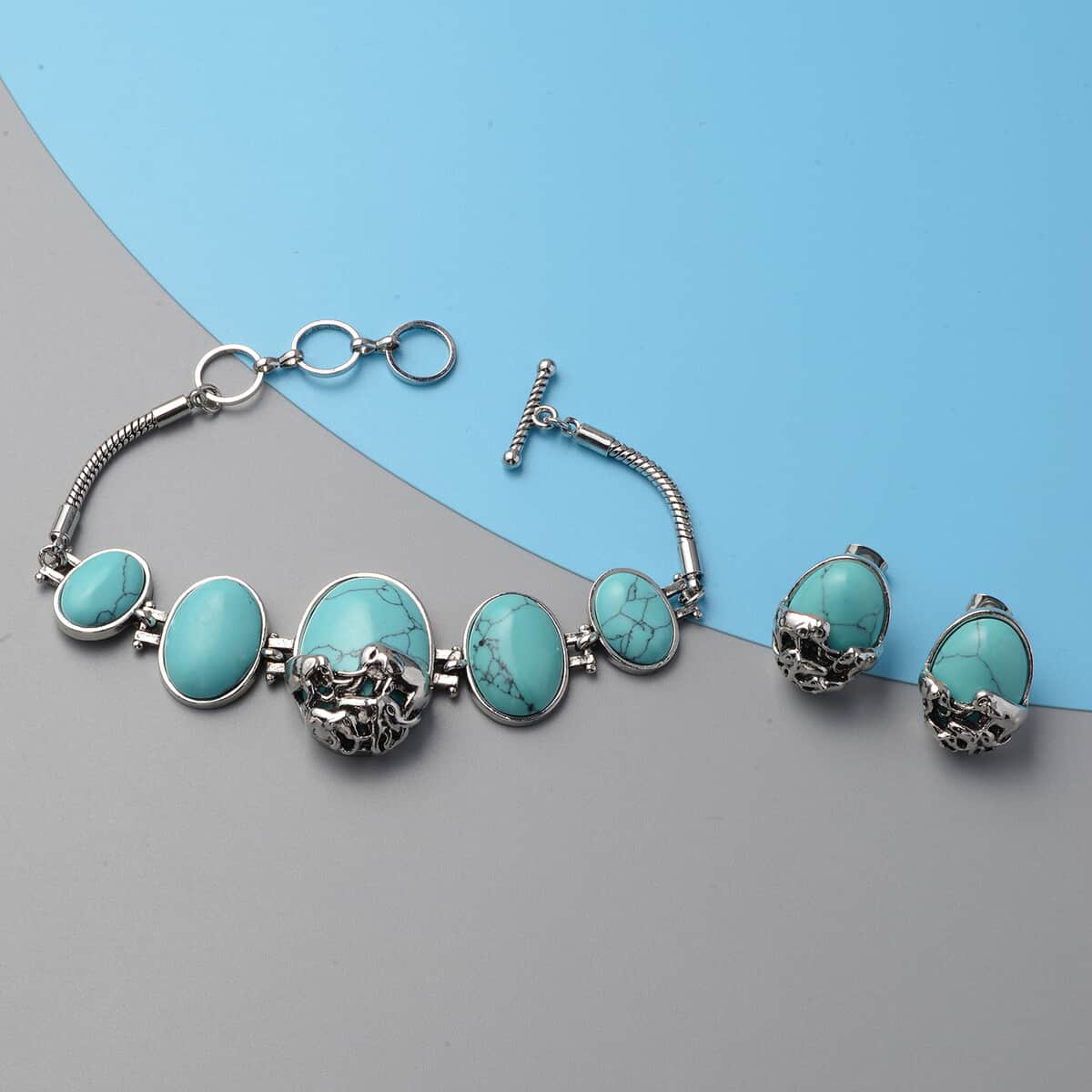 117.00 ctw Blue Howlite Elephant Charm Station Bracelet 7.25 Inches and Earrings in Silvertone image number 1