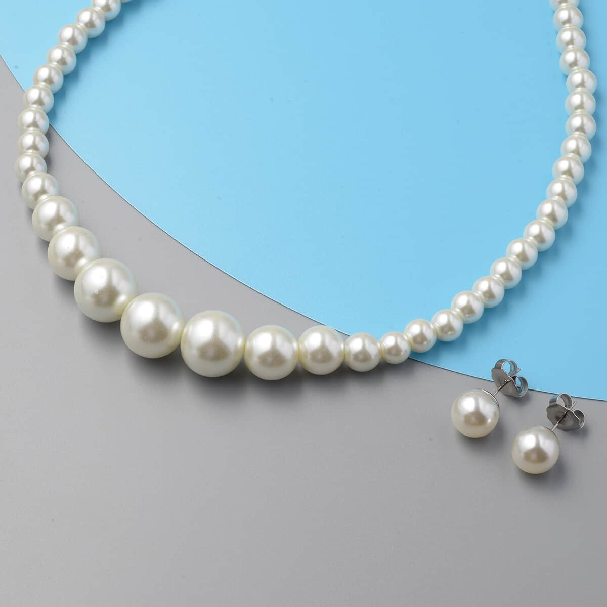 Set of 2 Simulated White Pearl Necklace 20-22 Inches and Earrings in Silvertone and Stainless Steel image number 1