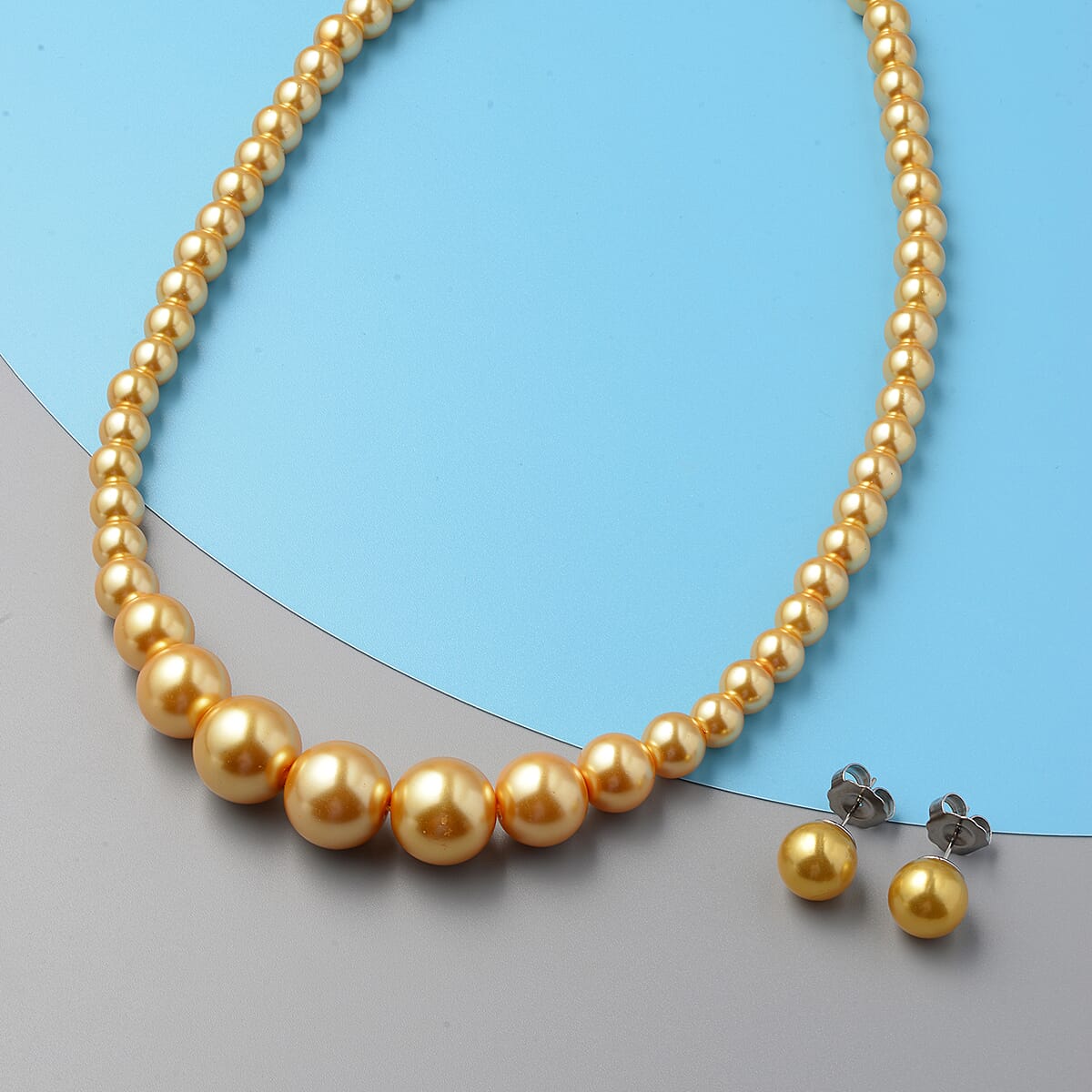 Set of 2 Simulated Golden Pearl Necklace 20-22 Inches and Earrings in Silvertone and Stainless Steel image number 1