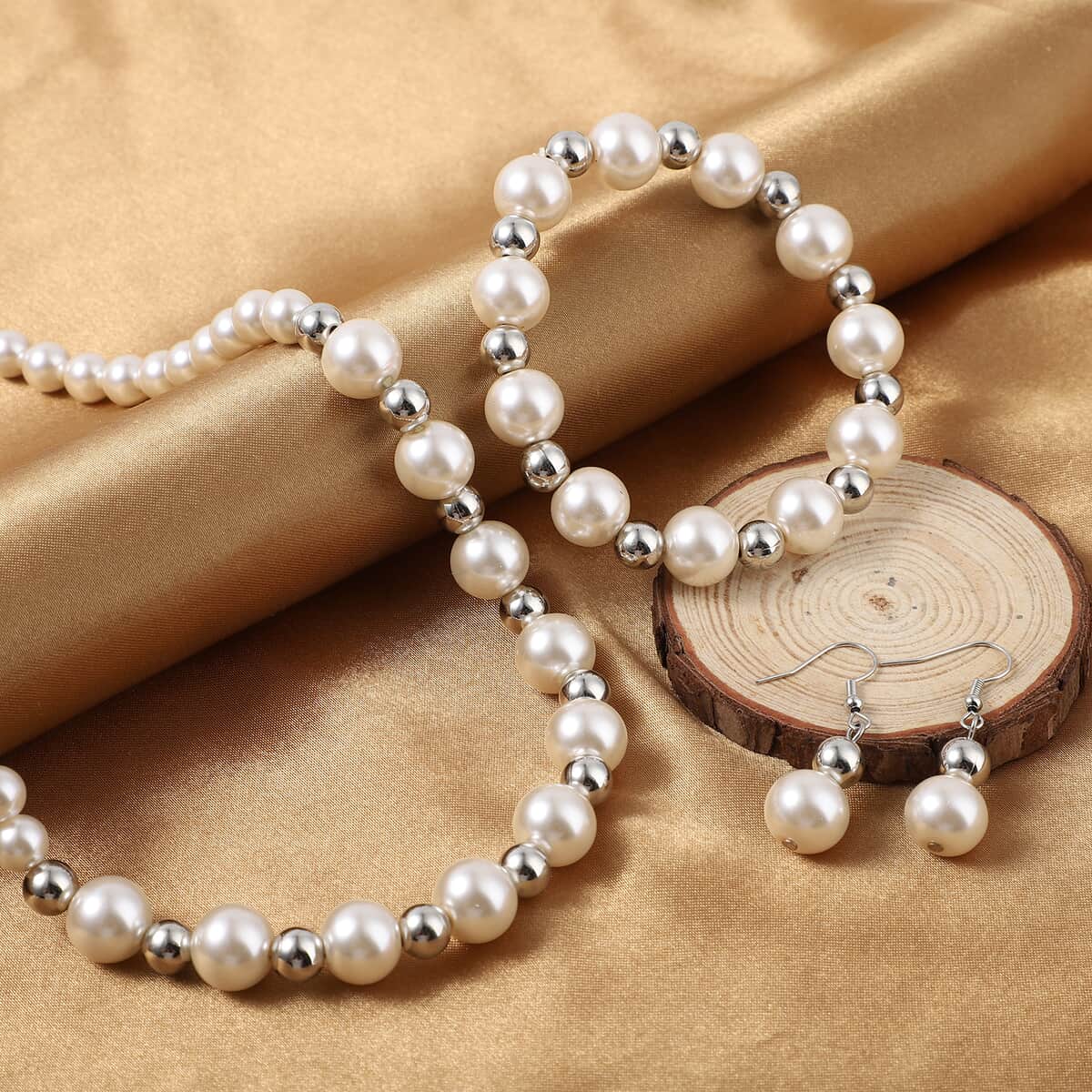 Simulated White Pearl and Resin Stretch Bracelet and Earring and Necklace 21-23 Inches in Silvertone & Stainless Steel image number 1