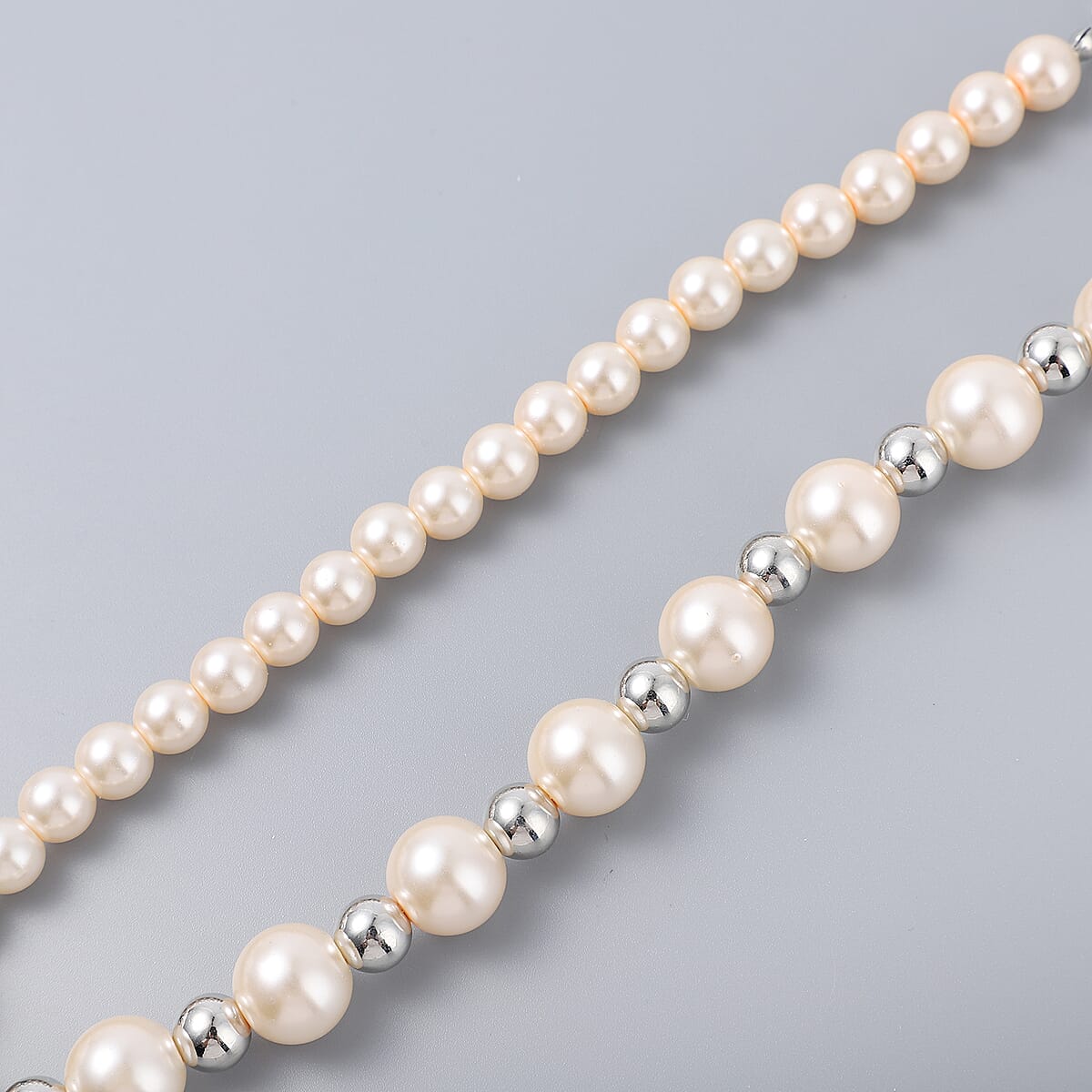 Simulated Peach Pearl and Resin Stretch Bracelet and Earrings and Necklace 21 Inches in Silvertone & Stainless Steel image number 3