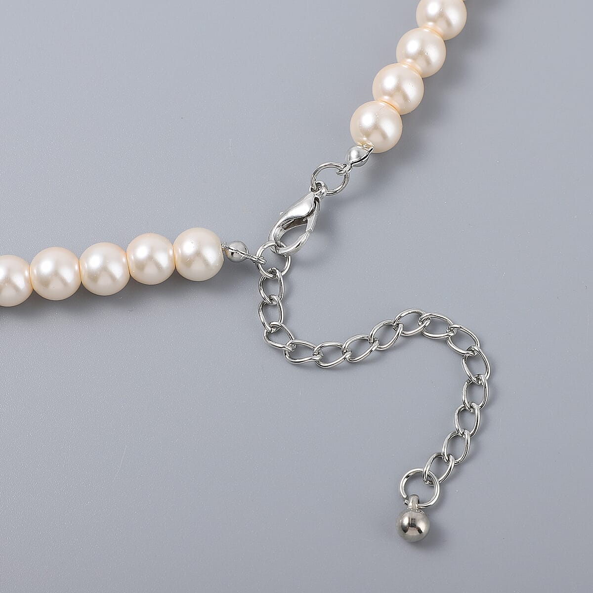 Simulated Peach Pearl and Resin Stretch Bracelet and Earrings and Necklace 21 Inches in Silvertone & Stainless Steel image number 4