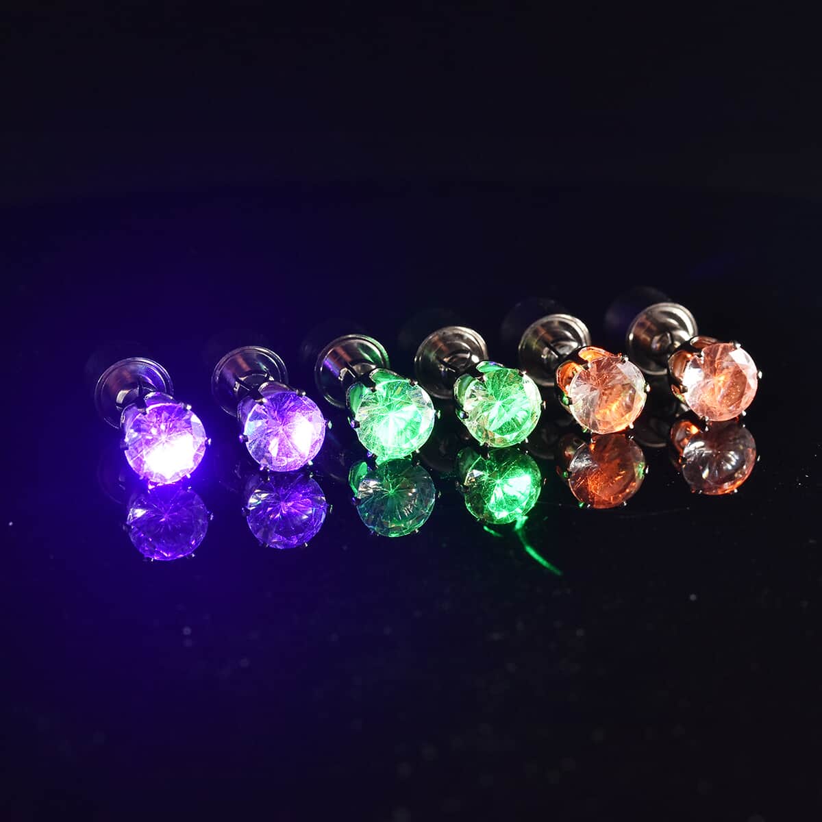 Set of 3 White Austrian Crystal Green, Purple and Orange LED Stud Earrings in Silvertone image number 1