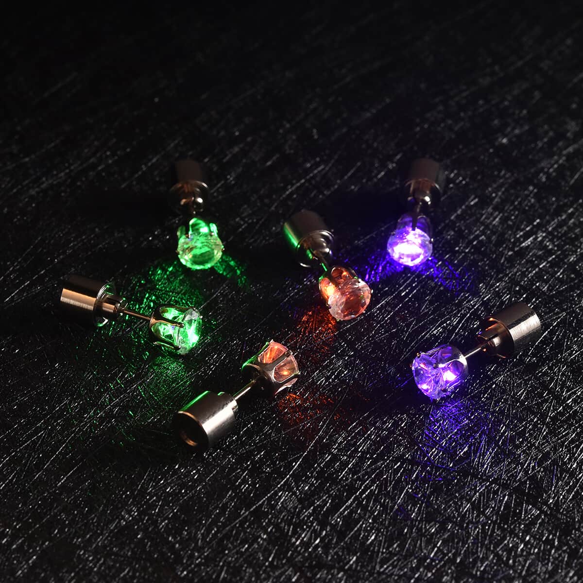 Set of 3 White Austrian Crystal Green, Purple and Orange LED Stud Earrings in Silvertone image number 2