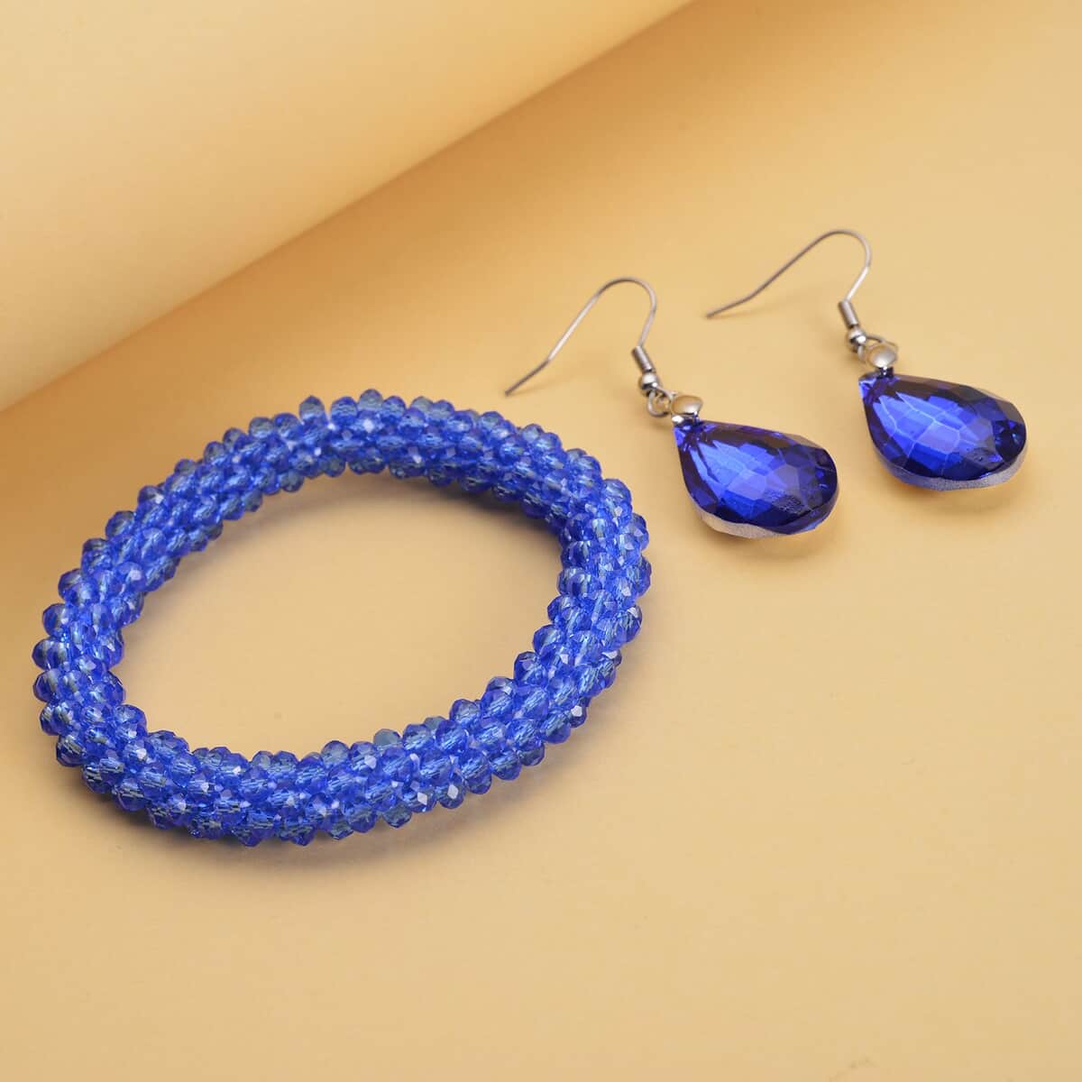 Simulated Blue Sapphire Beaded Stretch Bracelet and Drop Earrings in Silvertone image number 1