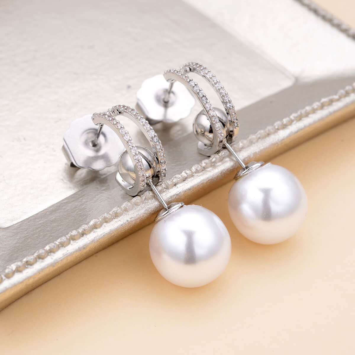 Set of 2 White Shell Pearl and Simulated Diamond Multi Ways Wearable Earrings in Silvertone image number 1