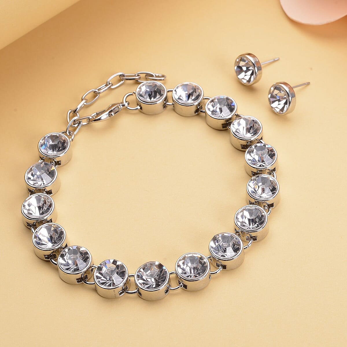 Austrian Crystal Tennis Bracelet (7.50-9.50In) and Stud Earrings in Silvertone image number 1