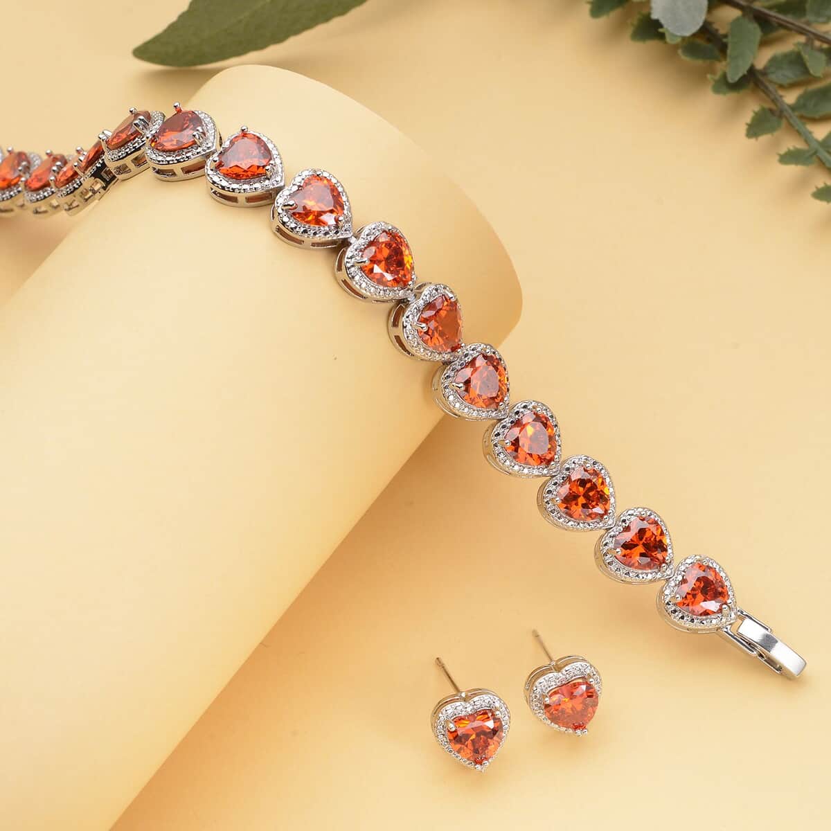 Simulated Orange Red Diamond Heart Shape Bracelet (6.50In) and Stud Earrings in Silvertone 45.00 ctw image number 1