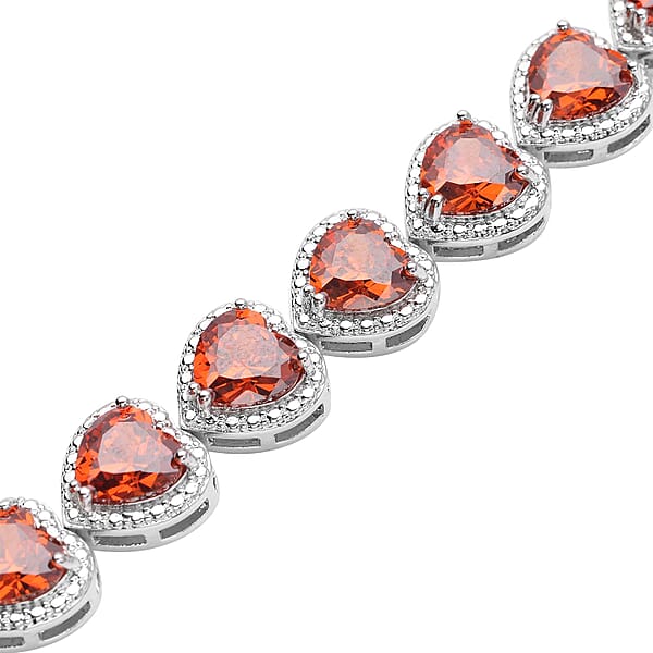 Simulated Orange Red Diamond Heart Shape Bracelet (6.50In) and Stud Earrings in Silvertone 45.00 ctw