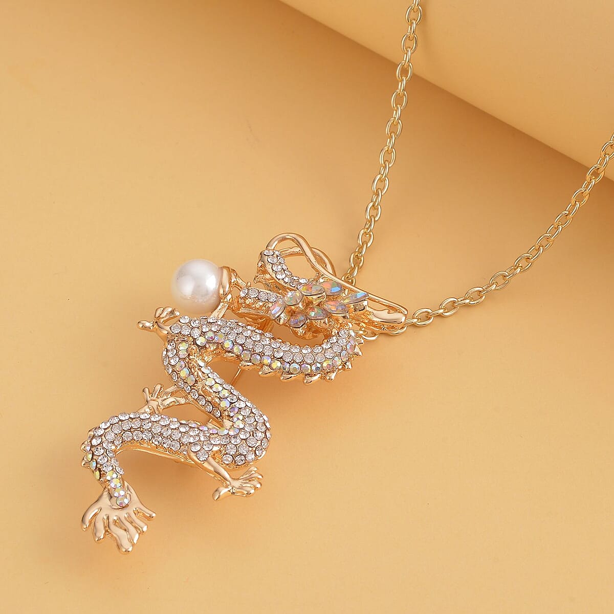 White Austrian Crystal and White Resin Dragon Pendant Necklace 28-30 Inches in Goldtone image number 1