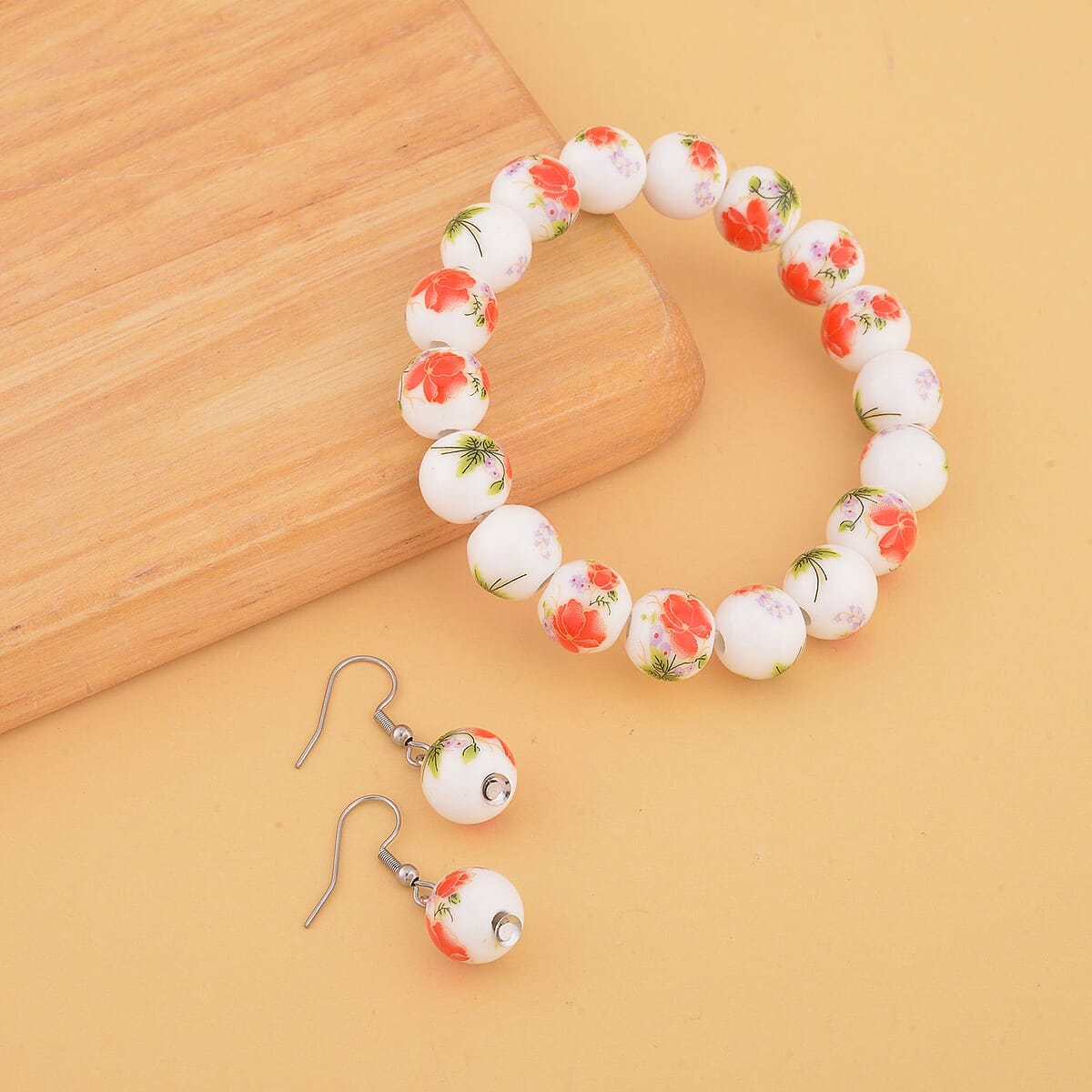 Orange Flower Ceramic Beaded Stretch Bracelet and Earrings in Stainless Steel 246.00 ctw , Tarnish-Free, Waterproof, Sweat Proof Jewelry image number 1