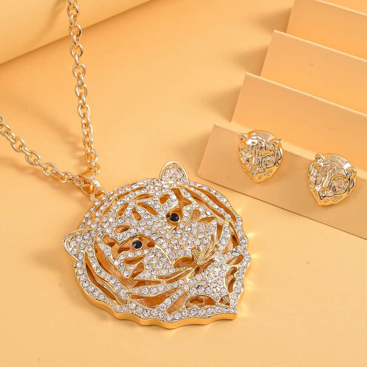 White and Black Austrian Crystal Earrings and Tiger Pendant Necklace (28-30 Inches) in Goldtone image number 1