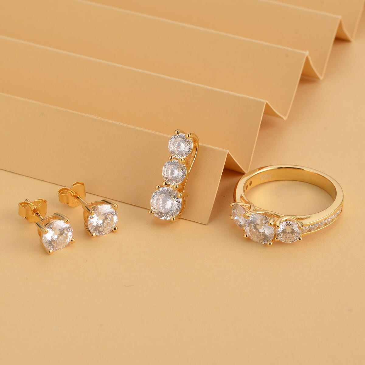 120 Facet Moissanite (Rnd 6.5mm) Trilogy Ring (SIZE 10.00), Pendant and Stud Earrings Jewelry Set For Women in Vermeil YG Over Sterling Silver 6.20 ctw image number 1