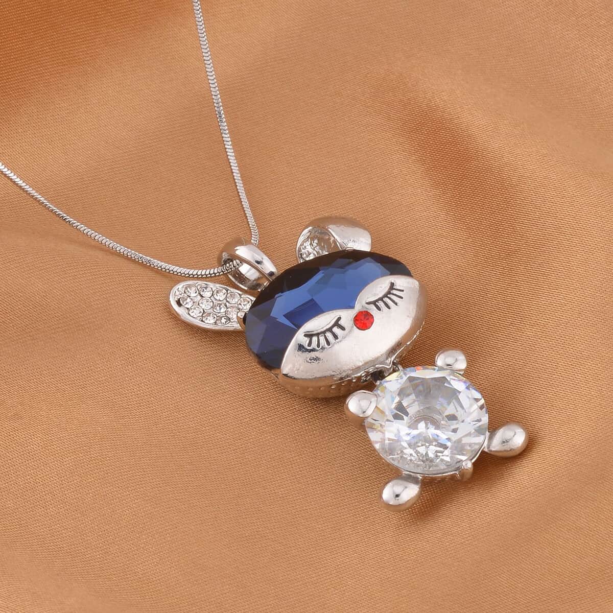 Blue and White Glass, Red and White Austrian Crystal Doll Charm Pendant Necklace 20-30 Inches in Silvertone image number 1