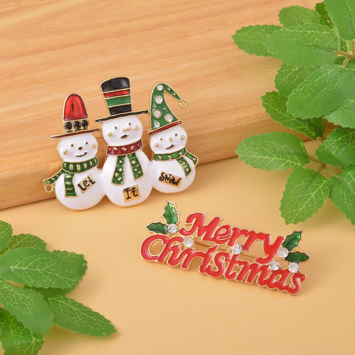 Set of 2 White & Green Austrian Crystal, Enameled Snowman & Merry Christmas Brooch in Goldtone image number 1