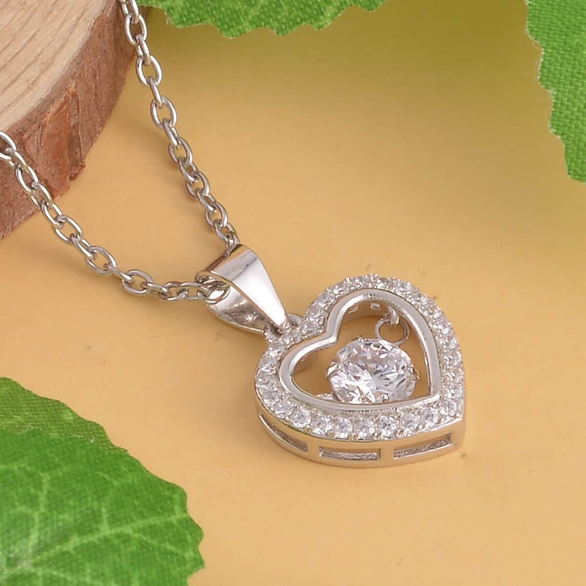 Simulated Diamond Heart Shape Dancing Pendant Necklace 20 Inches in Rhodium Over Sterling Silver and Stainless Steel 1.00 ctw image number 1