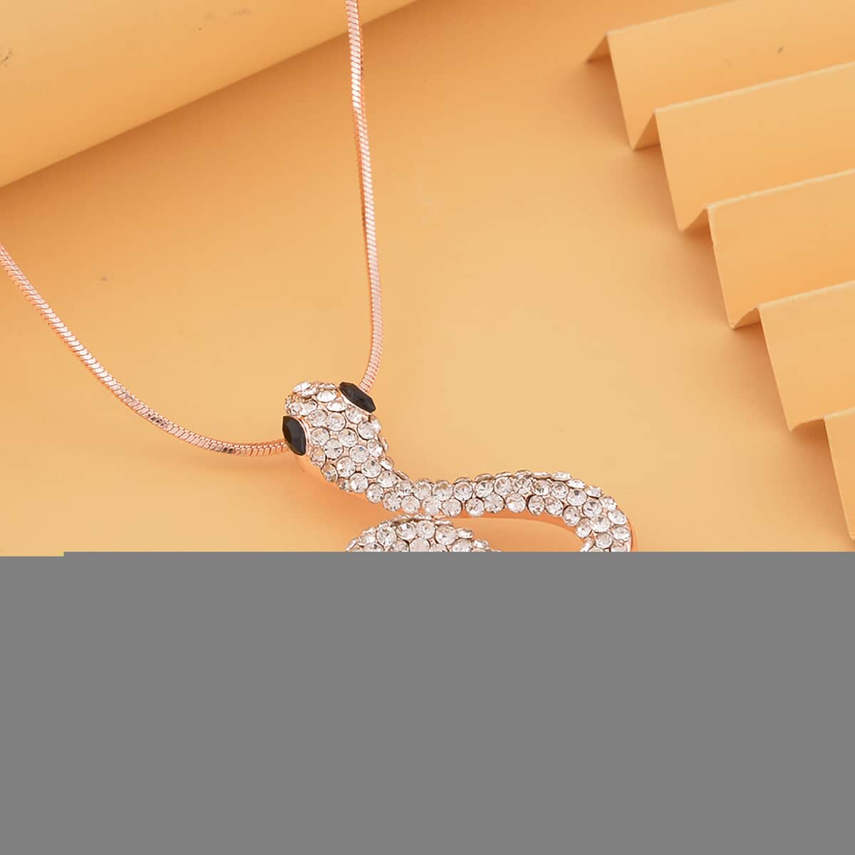 Black Glass and White Austrian Crystal Snake Pendant Necklace in Rosetone 28-30 Inches image number 1