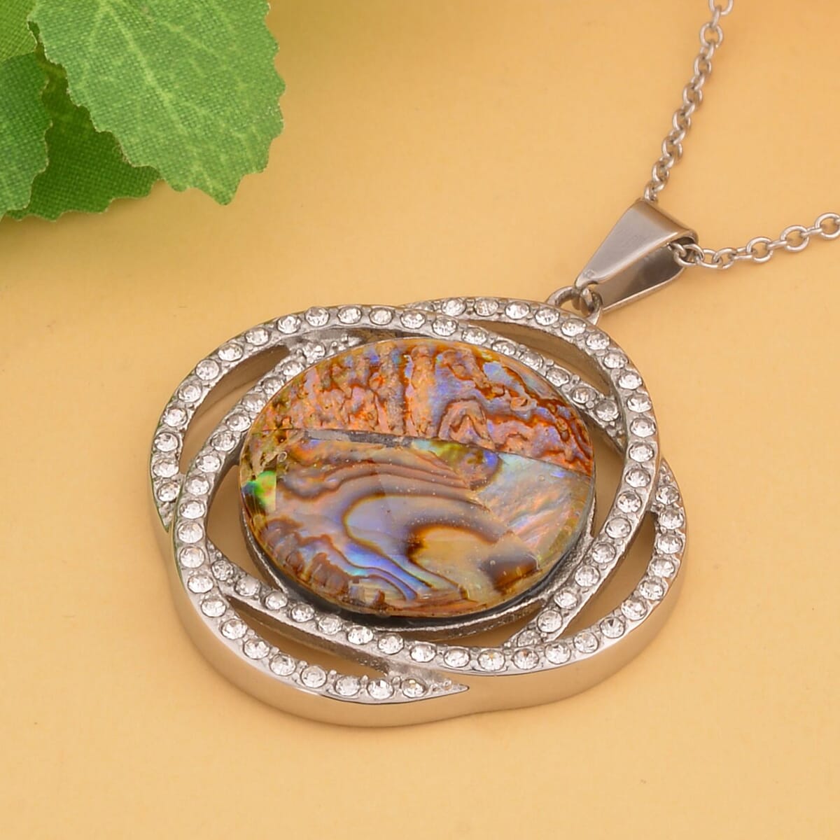 Abalone Shell and White Austrian Crystal Curvy Round Pendant Necklace 20 Inches in Stainless Steel image number 1