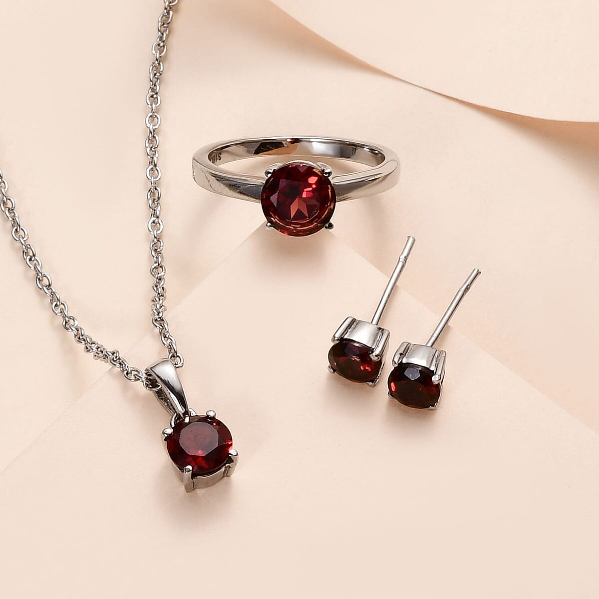 Mozambique Garnet Solitaire Stud Earrings, Ring (Size 7.0) and Pendant Necklace 20 Inches in Stainless Steel 3.75 ctw image number 1