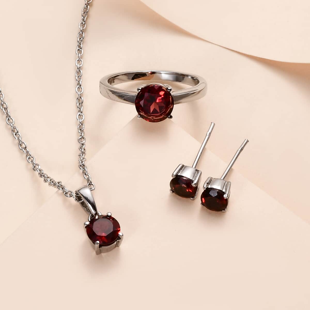 Mozambique Garnet Solitaire Stud Earrings, Ring (Size 8.0) and Pendant Necklace 20 Inches in Stainless Steel 3.75 ctw image number 1