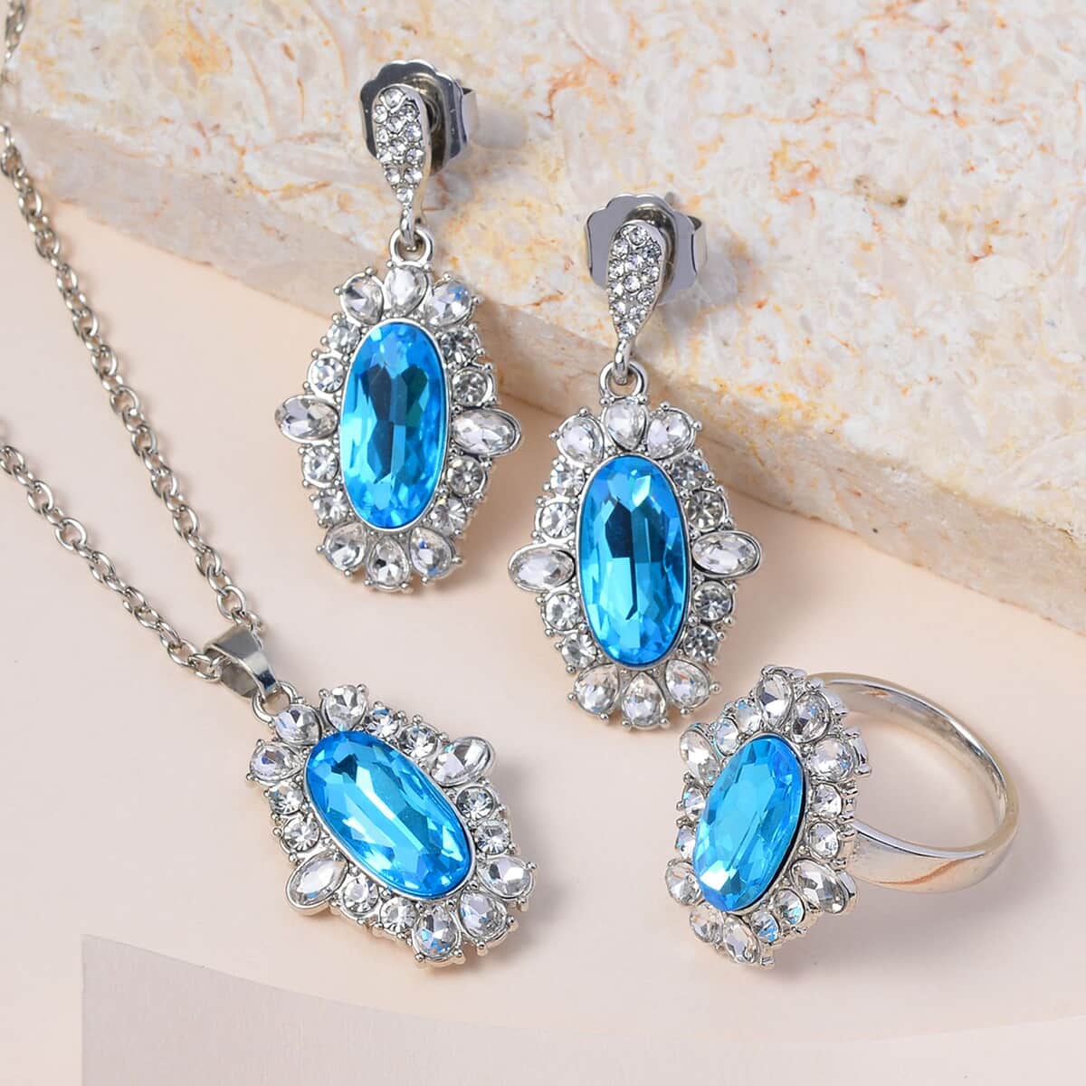 Simulated Aquamarine, Austrian Crystal Halo Ring (Size 10.00), Earrings and Pendant Necklace 20-22 Inches in Silvertone image number 1