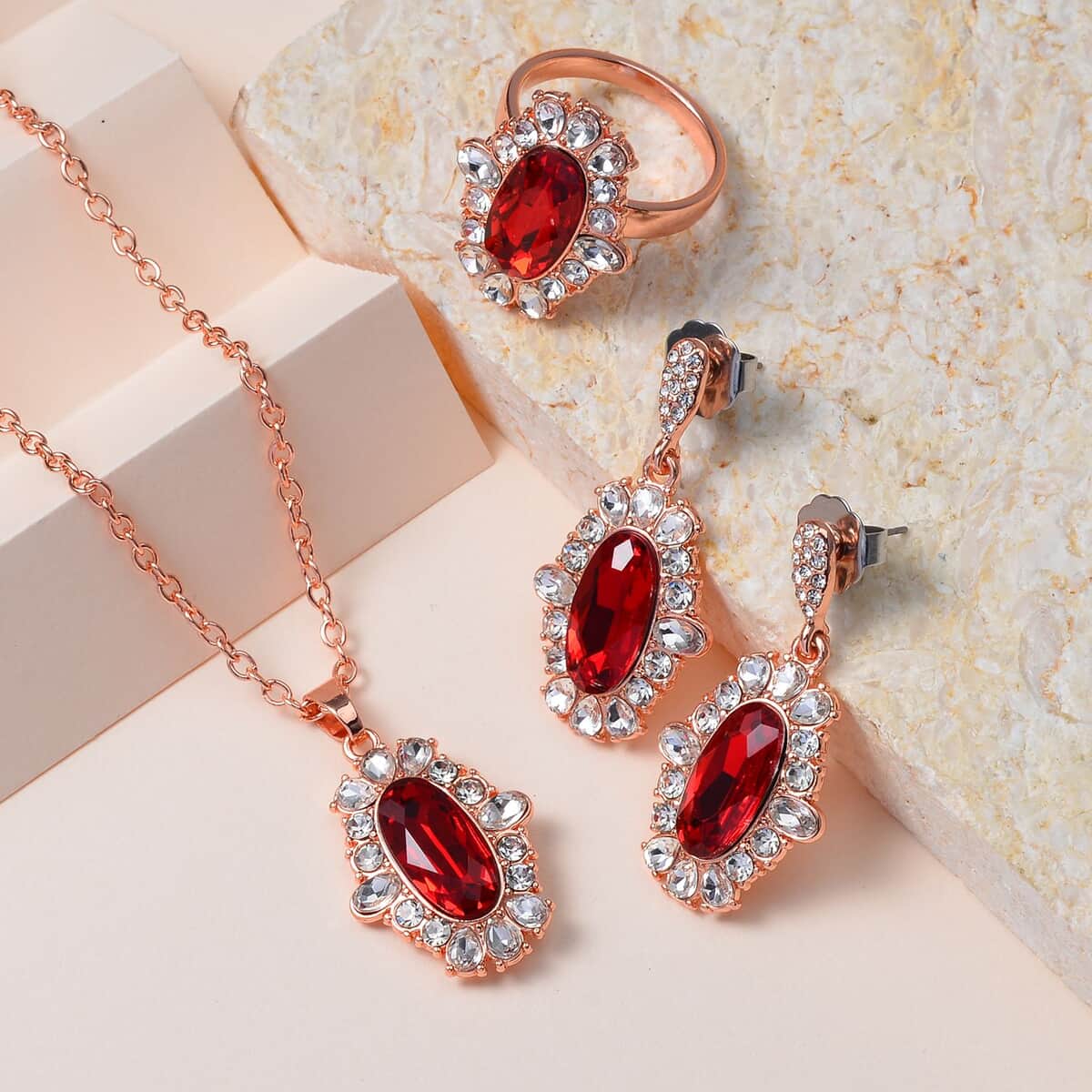 Simulated Ruby, Austrian Crystal Halo Ring (Size 6.00), Earrings and Pendant Necklace in Rosetone 20-22 Inches image number 1